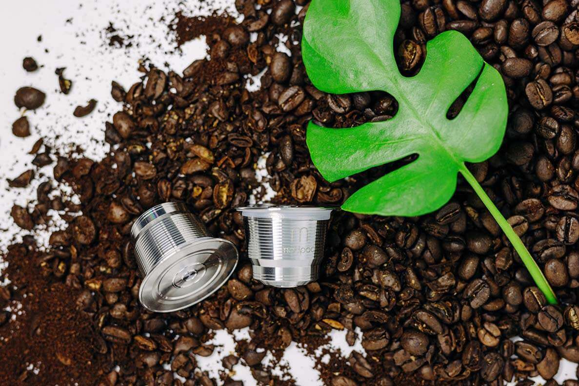 Nespresso reusable coffee pod in coffee beans